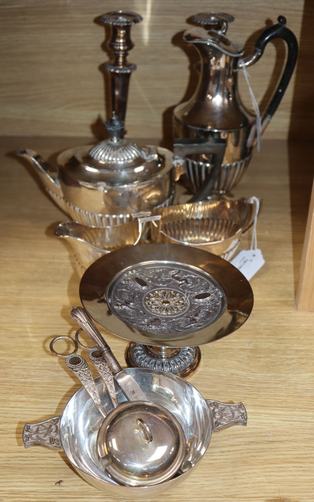 A pair of plated candlesticks, height 25cm and a small quantity of other plated items